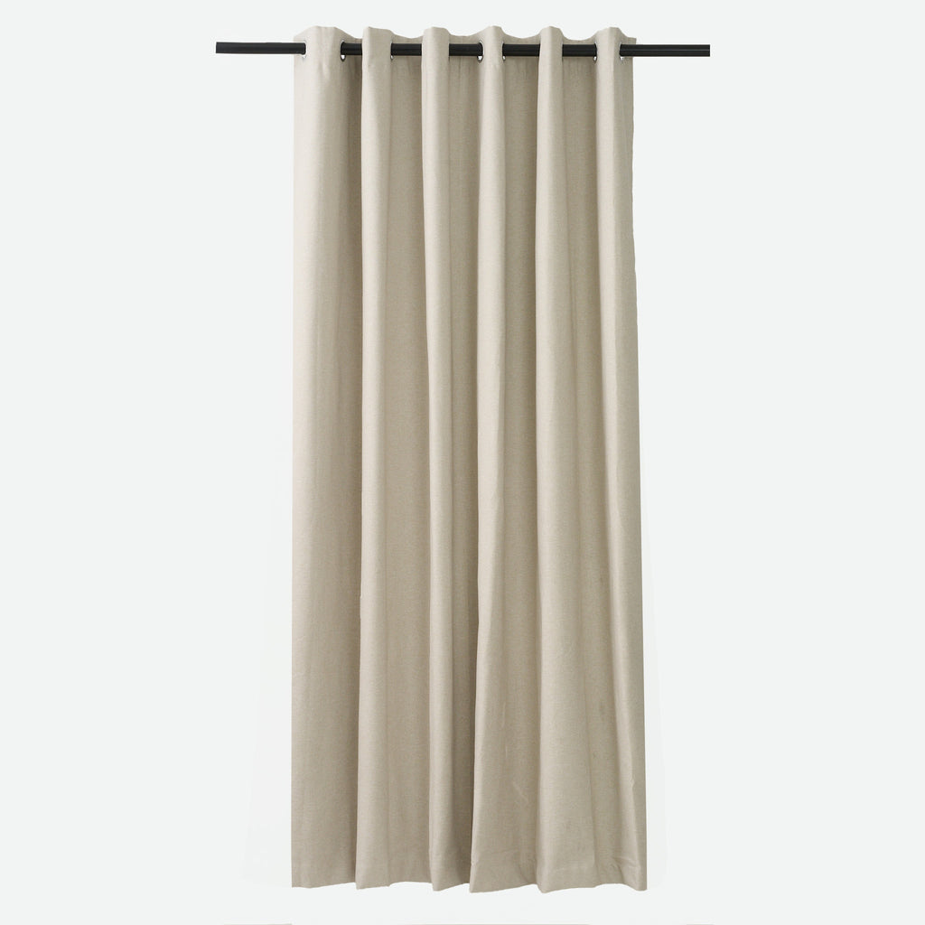 Dakota Textured 100% Block Out Eyelet Curtain in almond, hung from a rod showing the full-length drape