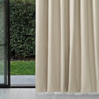 Almond Dakota block out curtain beside a sliding glass door with a garden view