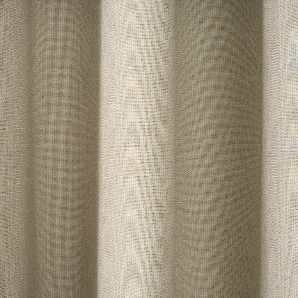 Close-up of the textured woven fabric on the Dakota block out curtain in almond