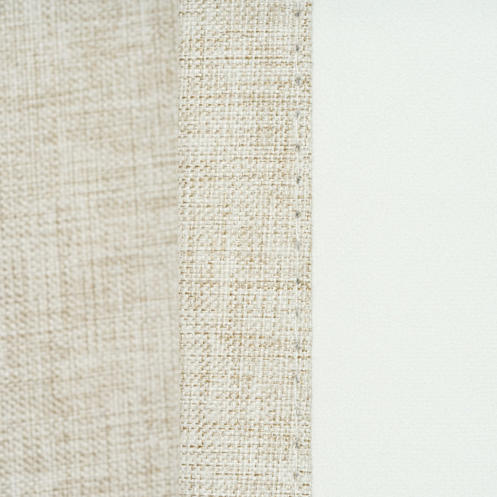 Close-up of the double-woven fabric texture and seam edge on the Sinclair curtain in light stone