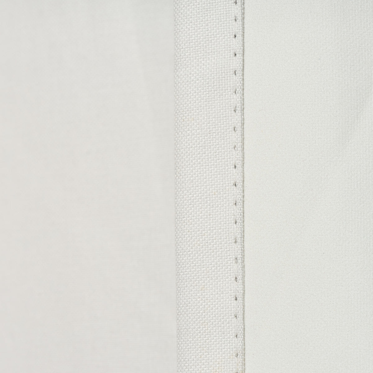 Close-up of the seam edge stitching on the Sinclair block out curtain in white